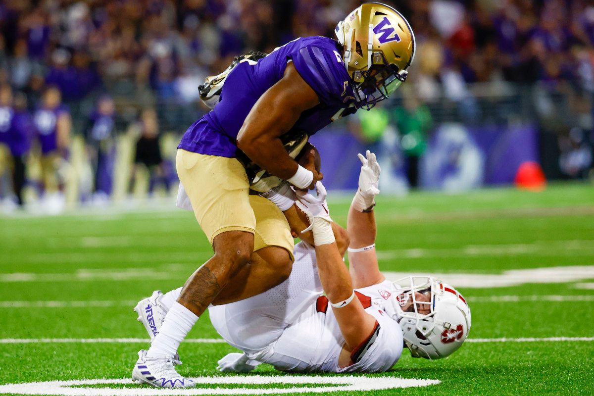 Washington Huskies linebacker Cam Bright (2) intercepts a pass intended for Stanford Cardinal running back Casey Filkins (2) during the first quarter at Alaska Airlines Field at Husky Stadium.