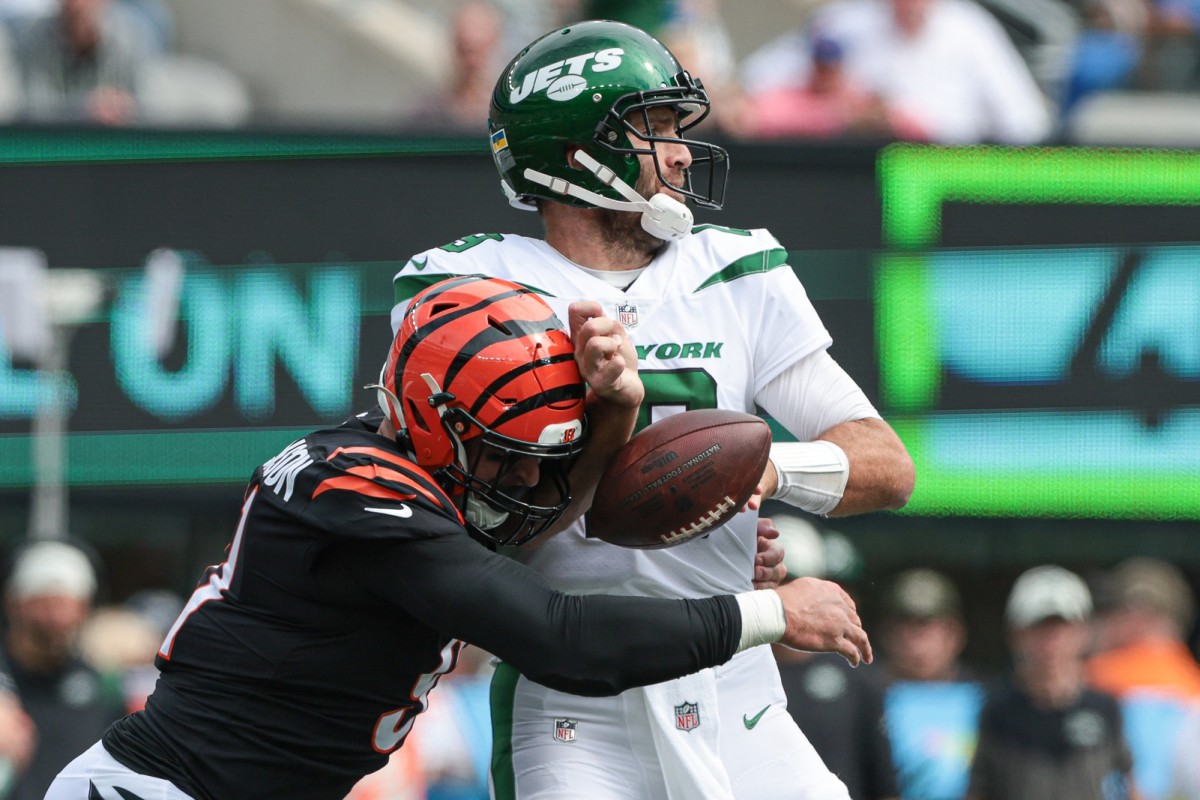 Sep 25, 2022; East Rutherford, New Jersey, USA; Cincinnati Bengals defensive end Trey Hendrickson (91) forces a fumble by New York Jets quarterback Joe Flacco (19) during the first half at MetLife Stadium. Mandatory Credit: Vincent Carchietta-USA TODAY Sports