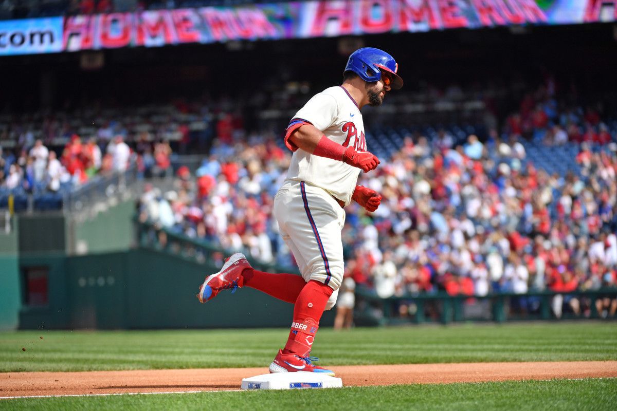 Kyle Schwarber rounds the bases after hitting his first home run of the game.