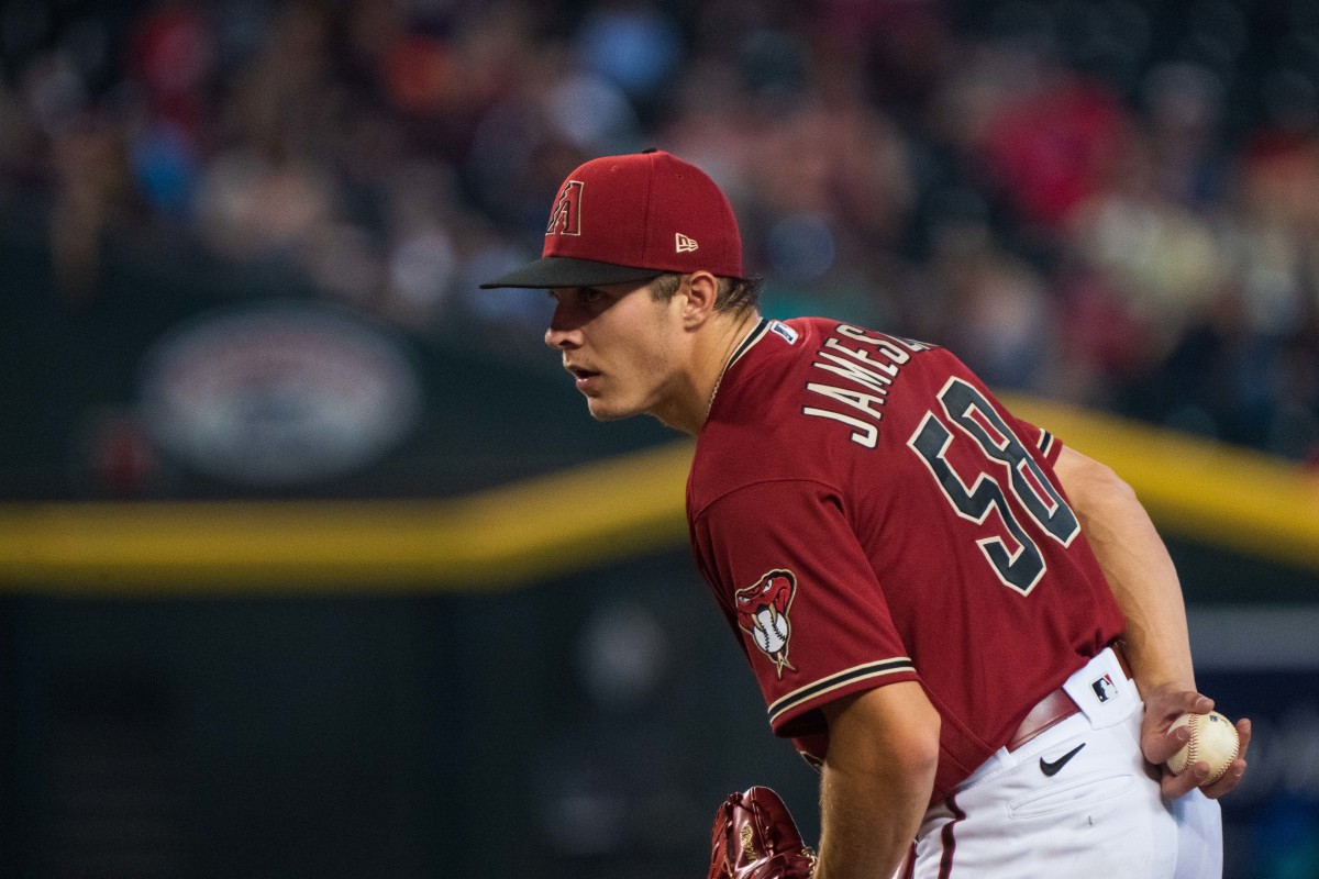 Diamondbacks pitcher Drey Jameson looks into the plate for a sign during a game against the SF Giants. (2022)