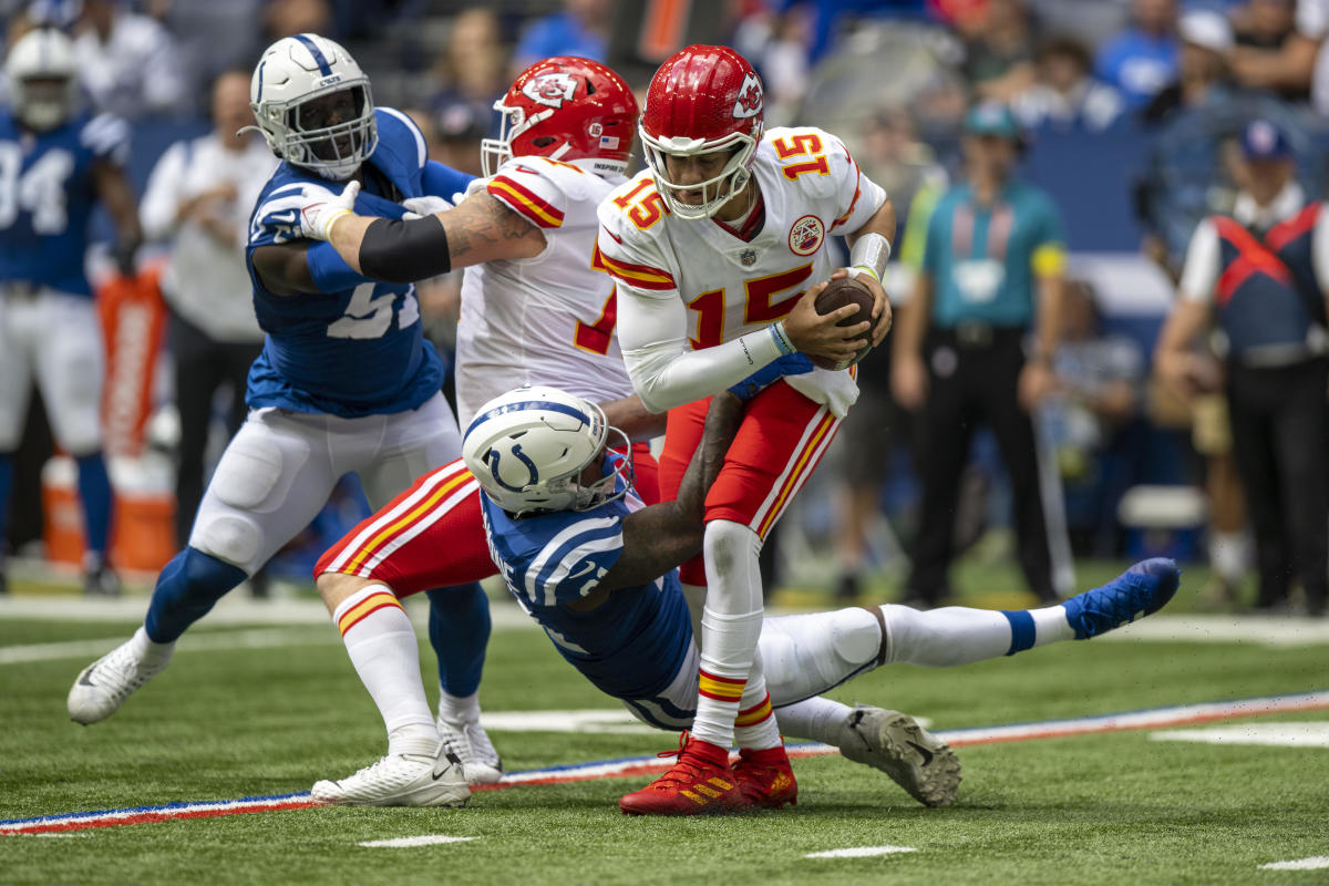 Sep 25, 2022; Indianapolis, Indiana, USA; Kansas City Chiefs quarterback Patrick Mahomes (15) is sacked by Indianapolis Colts defensive end Yannick Ngakoue (91) during the second quarter at Lucas Oil Stadium.
