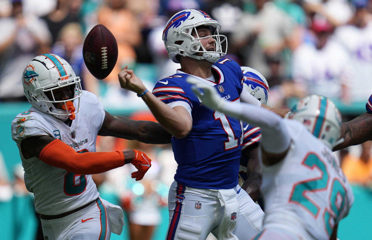 Jevon Holland strips the ball from Josh Allen during the Dolphins' win over the Bills