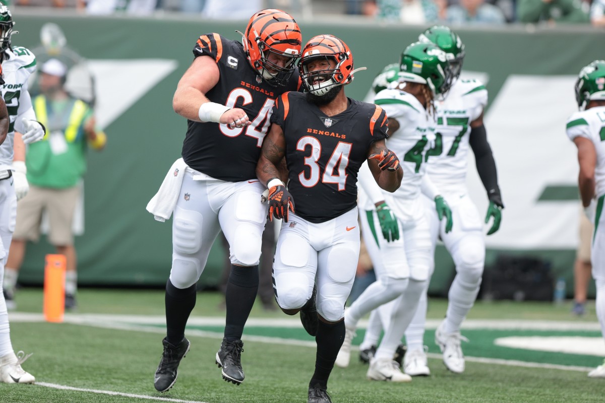 Sep 25, 2022; East Rutherford, New Jersey, USA; Cincinnati Bengals running back Samaje Perine (34) celebrates his touchdown with center Ted Karras (64) during the first half against the New York Jets at MetLife Stadium. Mandatory Credit: Vincent Carchietta-USA TODAY Sports