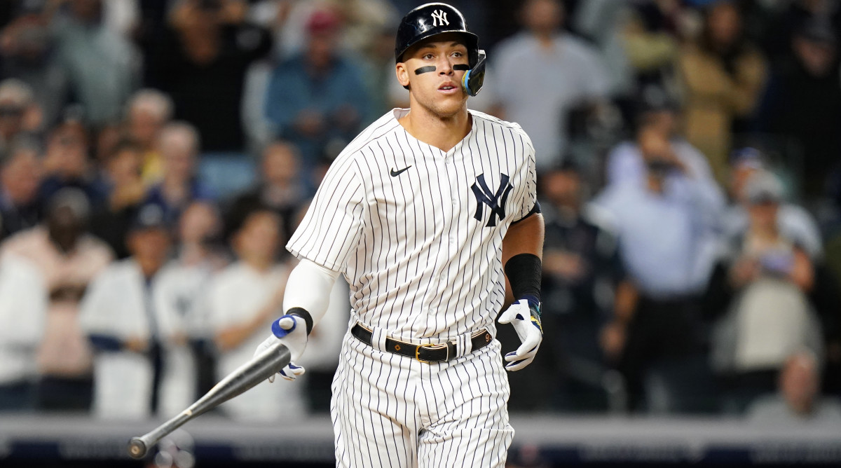 New York Yankees’ Aaron Judge tosses his bat after being walked during the first inning of a baseball game against the Boston Red Sox Thursday, Sept. 22, 2022, in New York.