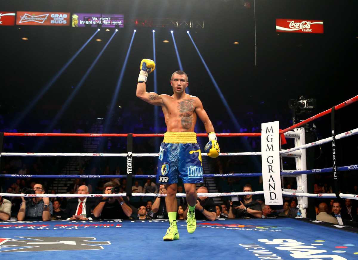 Vasyl Lomachenko celebrates following the fight against Gamalier Rodriguez (not pictured) during their WBO featherweight championship bout at MGM Grand Garden Arena.