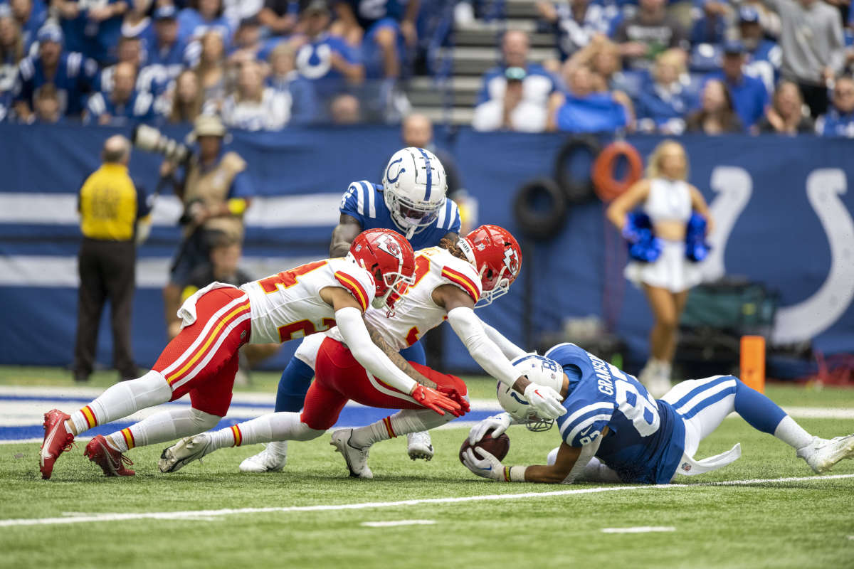 Sep 25, 2022; Indianapolis, Indiana, USA; Indianapolis Colts tight end Kylen Granson (83) recovers a fumble during the first quarter against the Kansas City Chiefs at Lucas Oil Stadium.