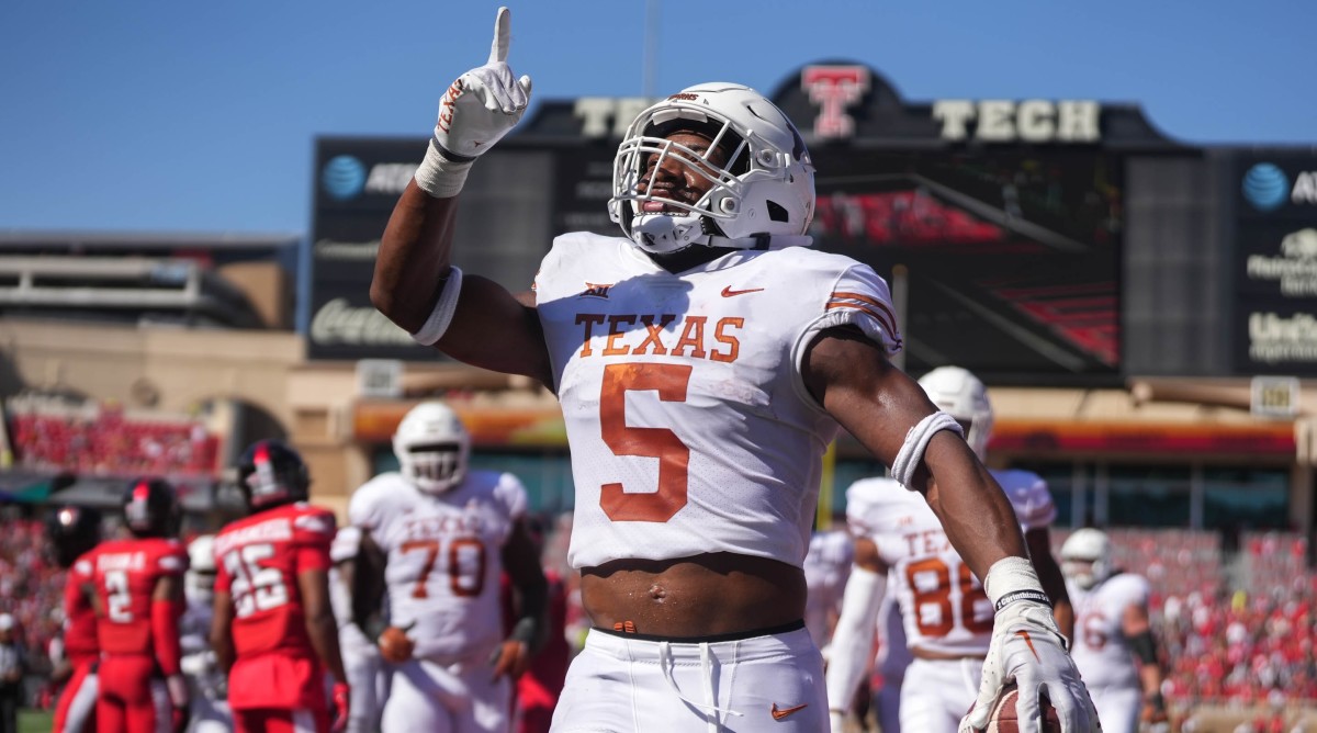 Texas Longhorns running back Bijan Robinson (5) celebrates after a touchdown against the Texas Tech Red Raiders.