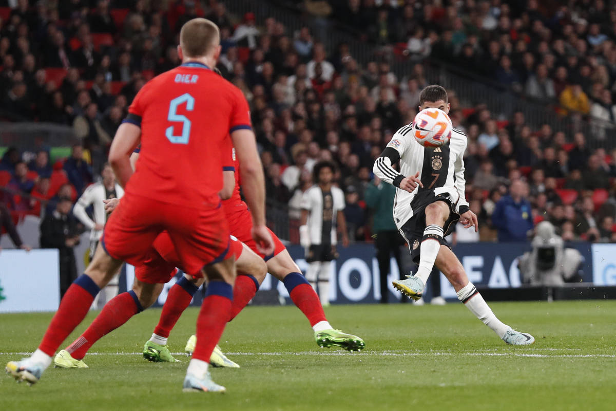 Kai Havertz pictured (right) shooting to score for Germany against England in September 2022