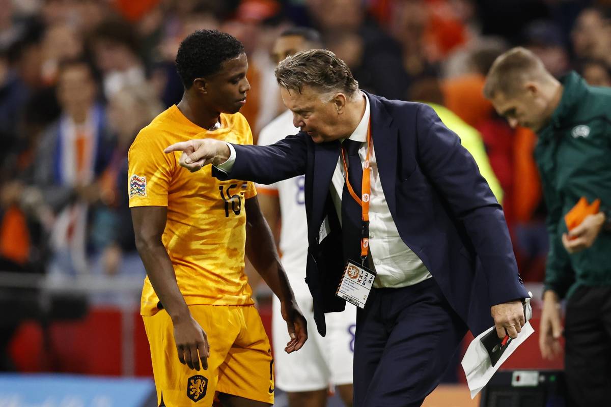 Holland manager Louis van Gaal pictured (right) giving instructions to defender Tyrell Malacia during a game against Belgium in September 2022