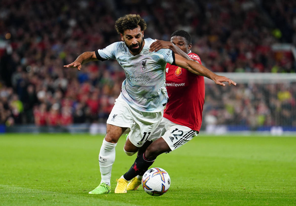 Manchester United left-back Tyrell Malacia pictured (right) challenging Liverpool forward Mo Salah during a Premier League game in August 2022