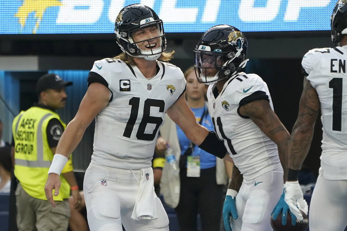 Jacksonville Jaguars quarterback Trevor Lawrence (16) and wide receiver Marvin Jones Jr. celebrate after connecting on a touchdown pass during the second half of an NFL football game against the Los Angeles Chargers in Inglewood, Calif., Sunday, Sept. 25, 2022.