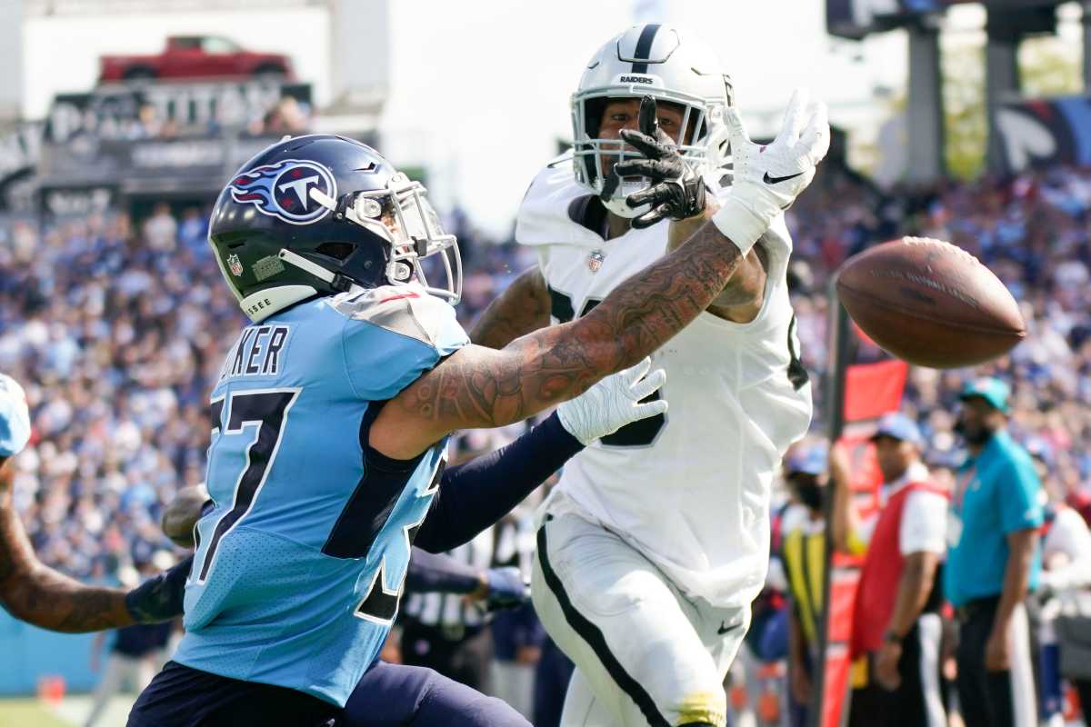 Tennessee Titans safety Amani Hooker (37) peaks up a pass intended for Las Vegas Raiders tight end Darren Waller (83) during the fourth quarter at Nissan Stadium.