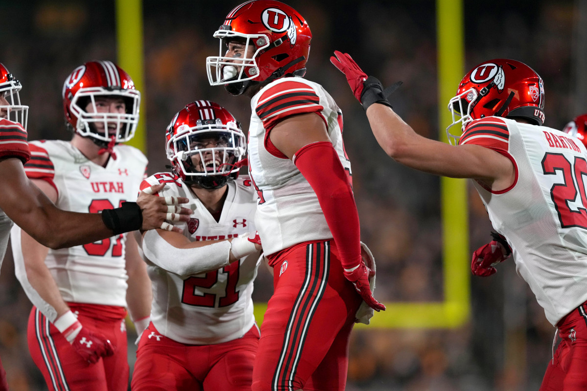 Utah Utes defensive end Gabe Reid (91) celebrates his sack against the Arizona State Sun Devils during the first half at Sun Devil Stadium.