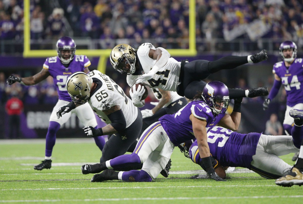 Jan 14, 2018; New Orleans Saints running back Alvin Kamara (41) is tackled by Minnesota Vikings linebacker Eric Kendricks (54) in the NFC Divisional Playoff game. Mandatory Credit: Brad Rempel-USA TODAY Sports