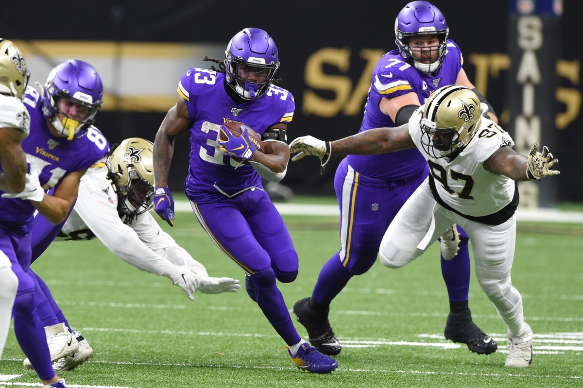 Jan 5, 2020; Minnesota Vikings running back Dalvin Cook (33) runs the ball against the New Orleans Saints during a NFC Wild Card playoff game. Mandatory Credit: John David Mercer-USA TODAY Sports