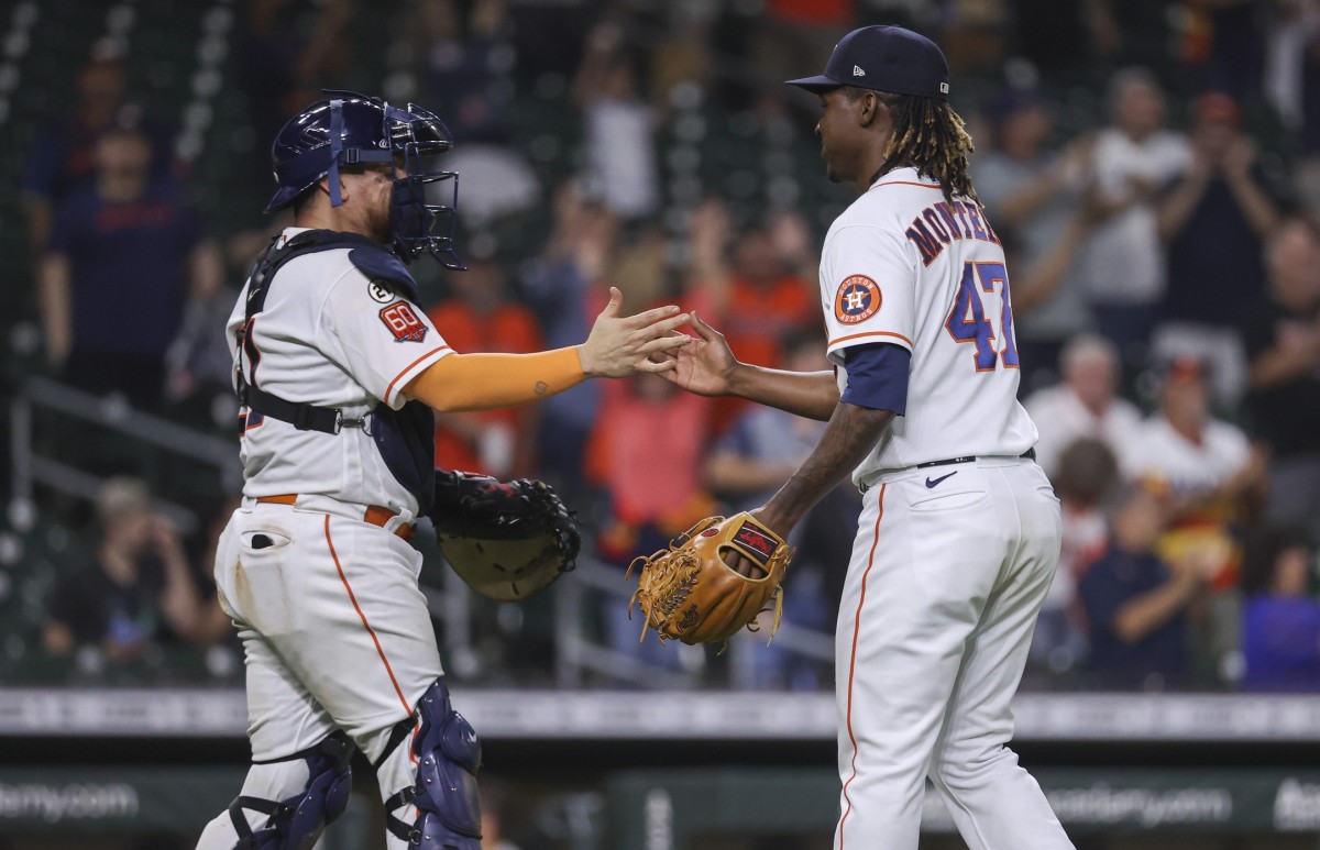 Sep 15, 2022; Houston, Texas, USA; Houston Astros catcher Christian Vazquez (21) celebrates with relief pitcher Rafael Montero (47) after the Astros defeated the Oakland Athletics at Minute Maid Park. Mandatory Credit: Troy Taormina-USA TODAY Sports