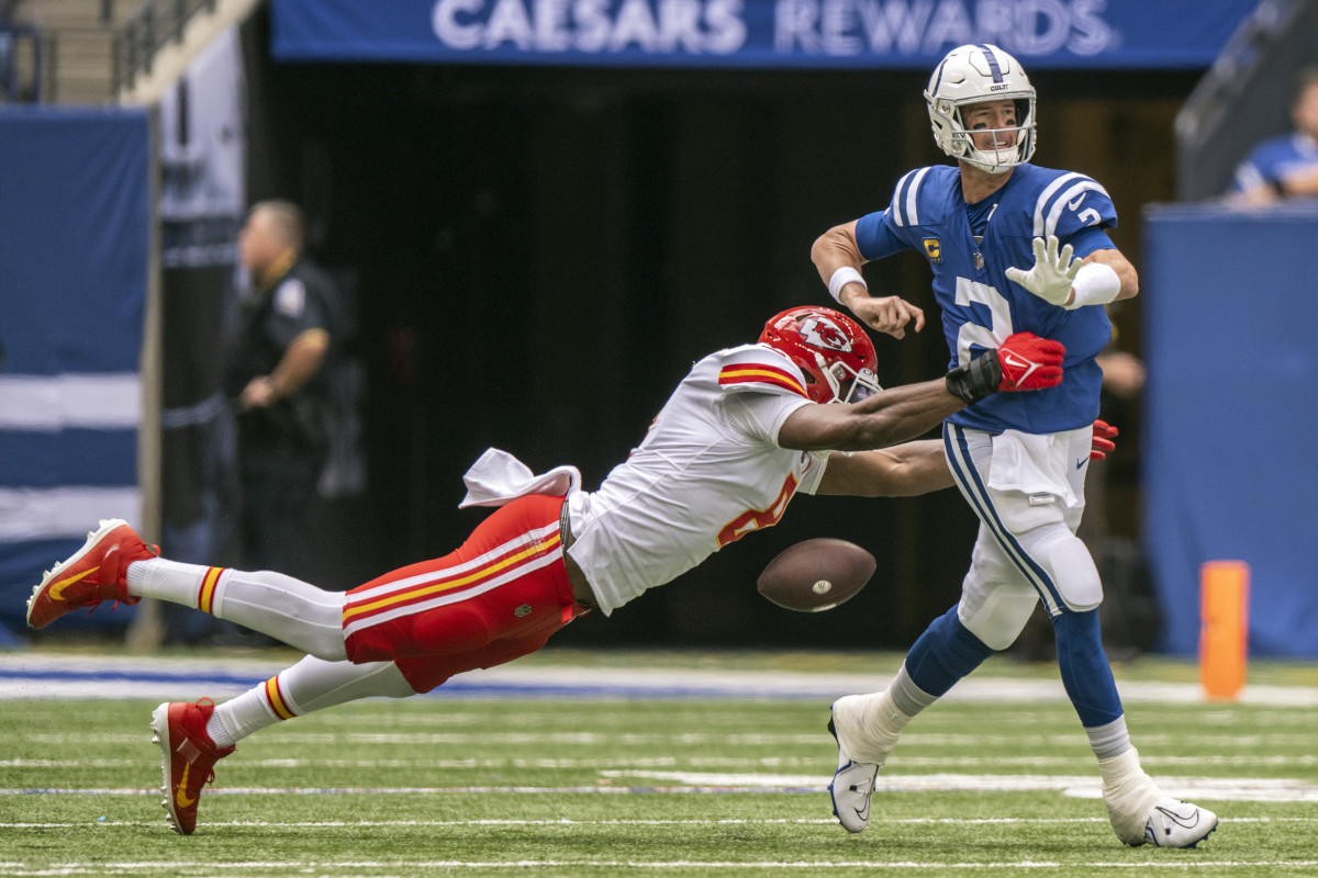 Sep 25, 2022; Indianapolis, Indiana, USA; Indianapolis Colts quarterback Matt Ryan (2) fumbles the ball while being sacked by Kansas City Chiefs defensive end Carlos Dunlap (8) during the second quarter at Lucas Oil Stadium. Mandatory Credit: Marc Lebryk-USA TODAY Sports