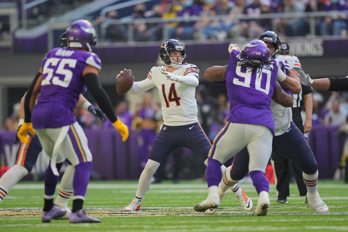Jan 9, 2022; Chicago Bears quarterback Andy Dalton (14) passes against the Minnesota Vikings at U.S. Bank Stadium. Mandatory Credit: Brad Rempel-USA TODAY Sports