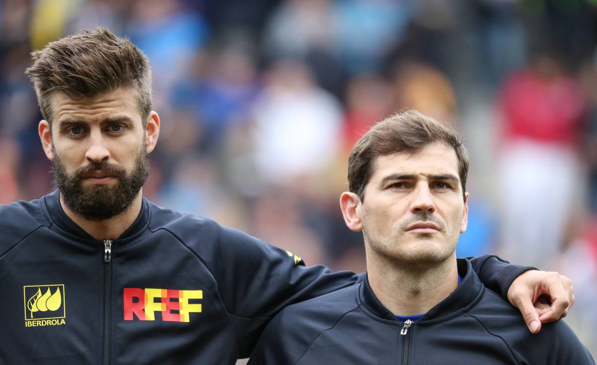 Gerard Pique (left) pictured with his arm around Spain teammate Iker Casillas before a match in 2016