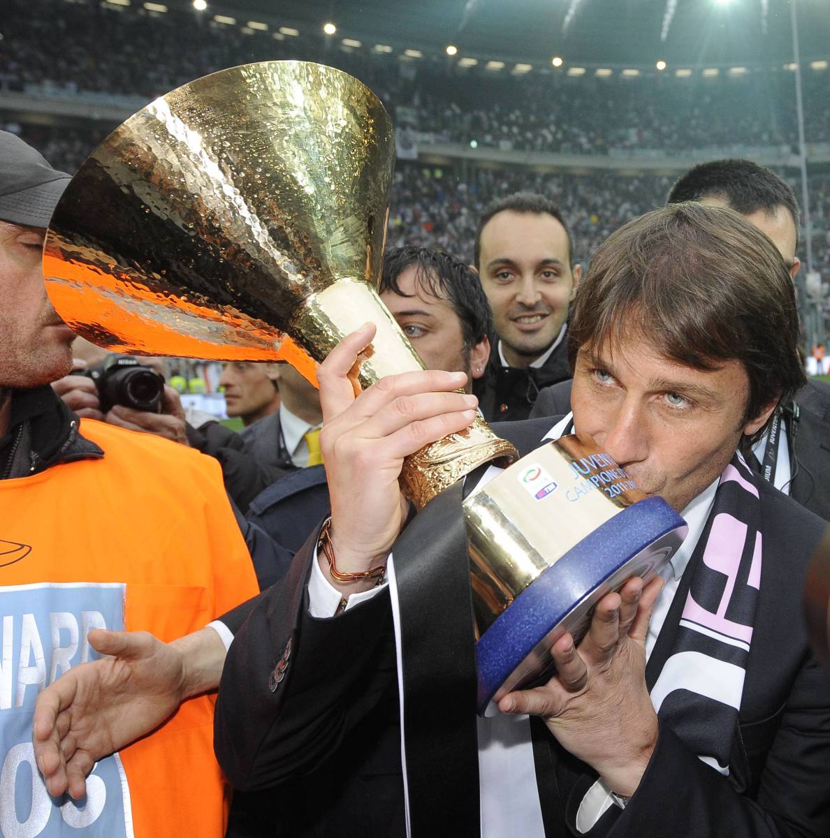 Manager Antonio Conte pictured kissing the trophy after leading Juventus to Serie A glory in the 2011/12 season