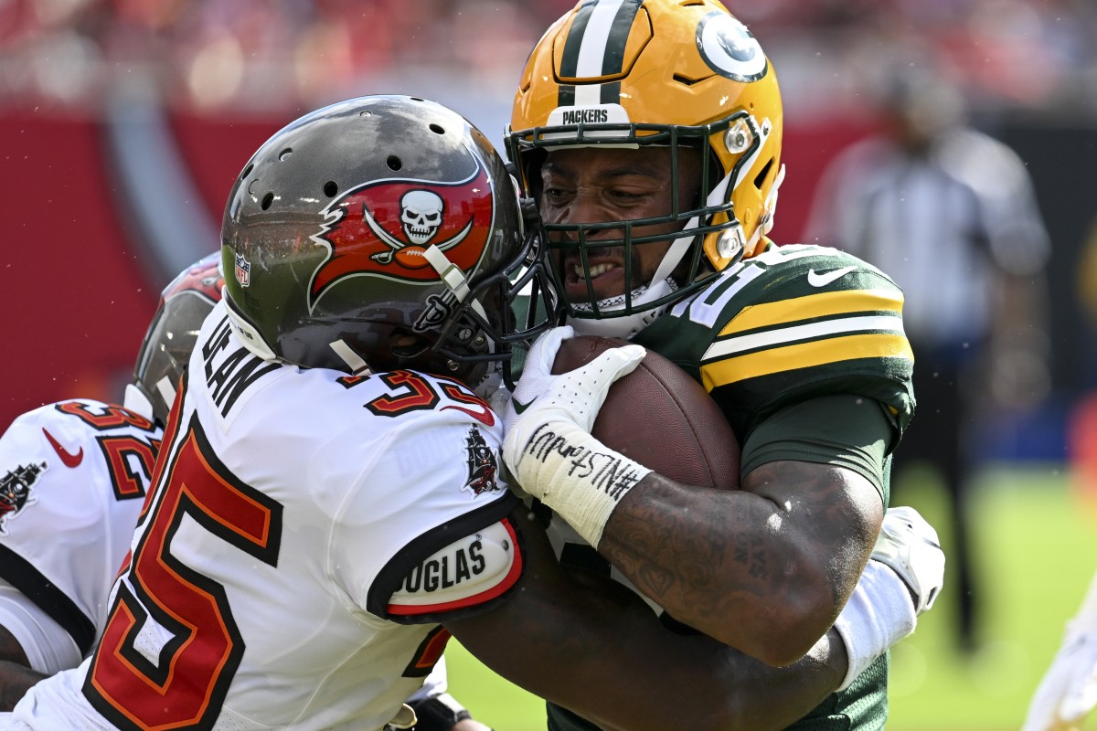 Tampa Bay Buccaneers' Jamel Dean stops Green Bay Packers' AJ Dillon during the first half of an NFL football game Sunday, Sept. 25, 2022, in Tampa, Fla. (AP Photo/Jason Behnken)