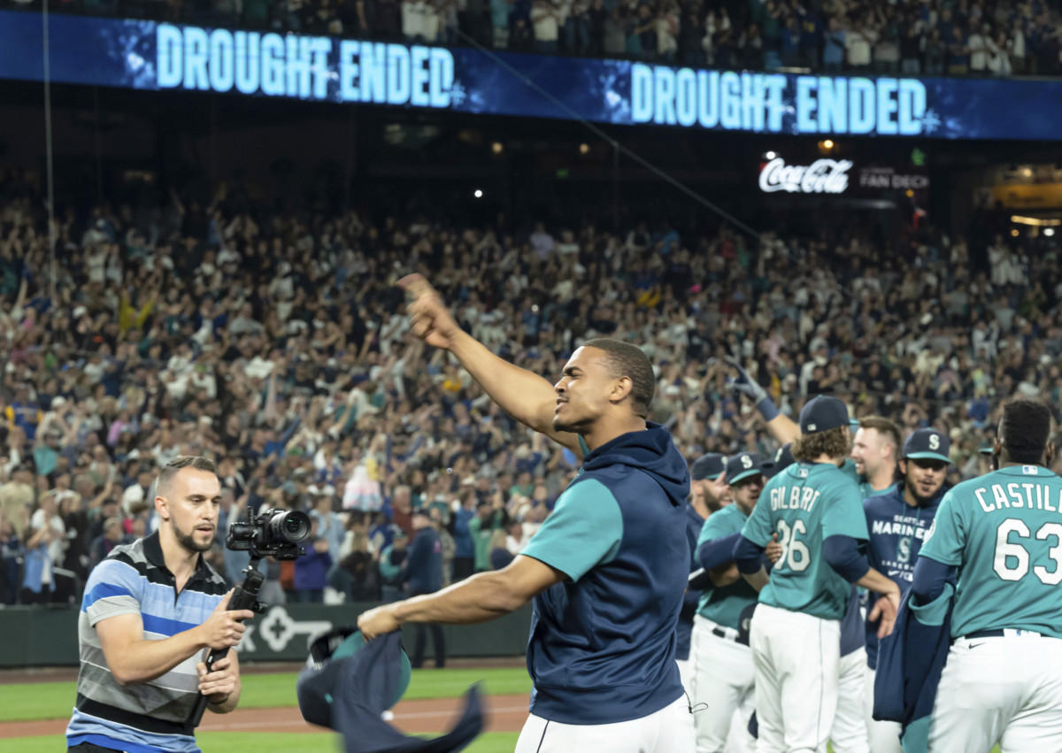 Seattle Mariners’ Julio Rodriguez celebrates on the field after the team’s baseball game against the Oakland Athletics, Friday, Sept. 30, 2022, in Seattle. The Mariners won 2-1 to clinch a spot in the playoffs.