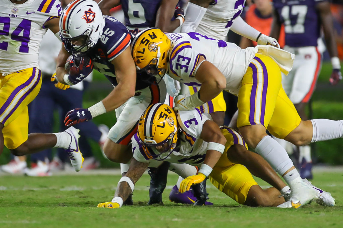 Auburn Tigers tight end John Samuel Shenker (25) gets tackled after gaining first down yardage during the game between the LSU Tigers and the Auburn Tigers at Jordan-Hare Stadium on Oct. 1, 2022.