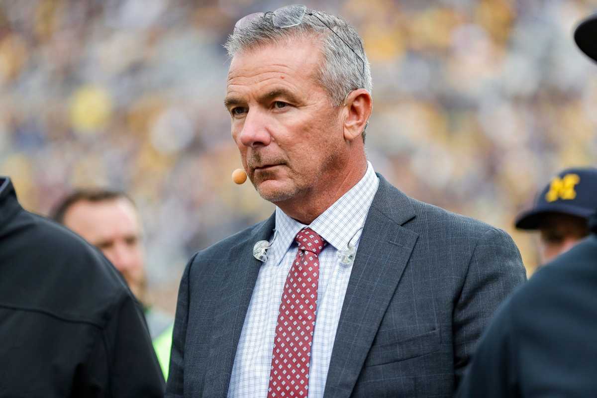 FOX Sports college football analyst Urban Meyer walks along the sideline before a game between Michigan and Maryland at Michigan Stadium in Ann Arbor on Saturday, Sept. 24, 2022.