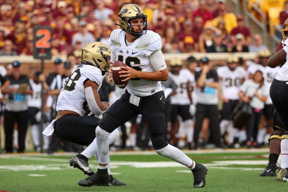 Oct 1, 2022; Minneapolis, Minnesota, USA; Purdue Boilermakers quarterback Aidan O'Connell (16) looks downfield against the Minnesota Golden Gophers during the second quarter at Huntington Bank Stadium.