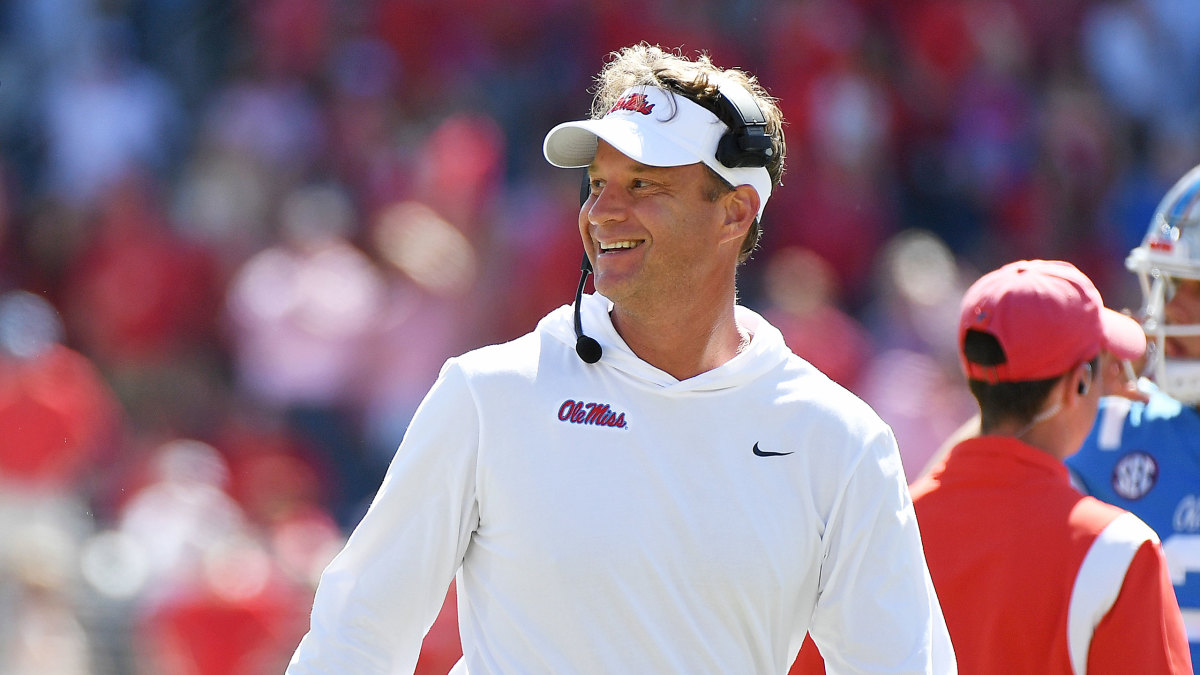 Ole Miss coach Lane Kiffin smiles on the sideline