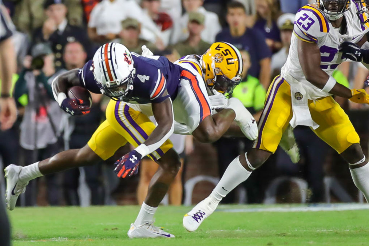 Auburn Tigers running back Tank Bigsby (4) goes airborne on the run during the game between the LSU Tigers and the Auburn Tigers at Jordan-Hare Stadium on Oct. 1, 2022.