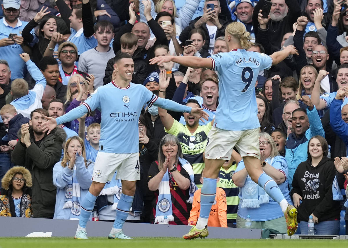 Phil Foden (left) and Erling Haaland pictured celebrating during Manchester City's 6-3 win over Manchester United in October 2022