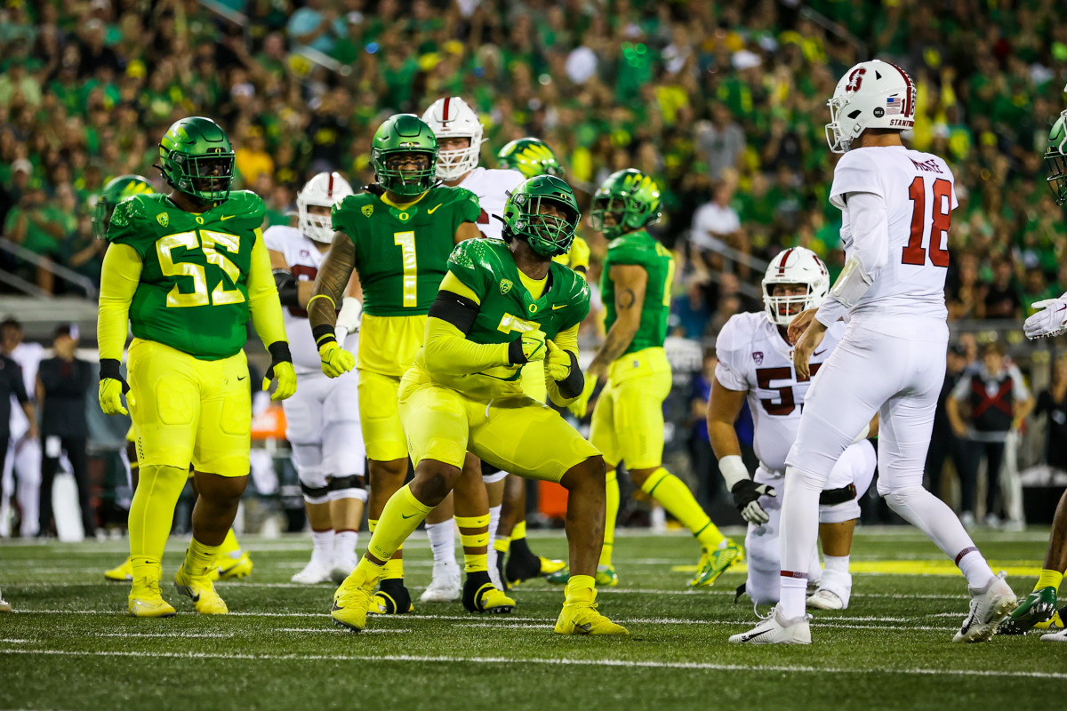 Oregon defensive end Brandon Dorlus celebrates a big play against the Stanford Cardinal.