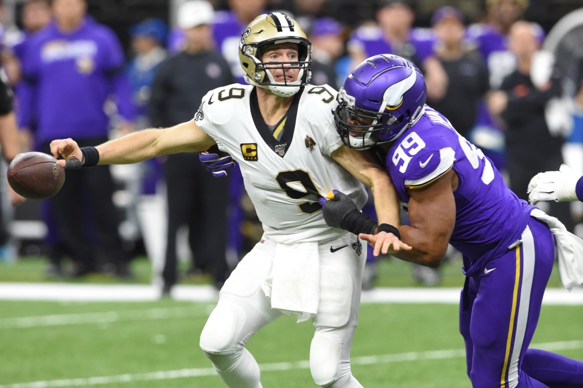 Jan 5, 2020; New Orleans Saints quarterback Drew Brees (9) fumbles the ball as he is sacked by Minnesota Vikings defensive end Danielle Hunter (99) during a NFC Wild Card game. Mandatory Credit: John David Mercer-USA TODAY