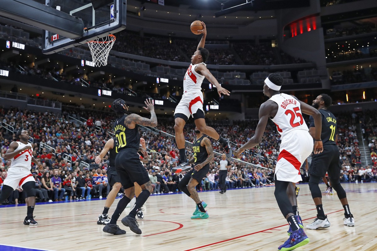 Toronto Raptors forward Scottie Barnes (4) dunks the ball over top of Utah Jazz guard Jordan Clarkson (00) during the first quarter at Rogers Place