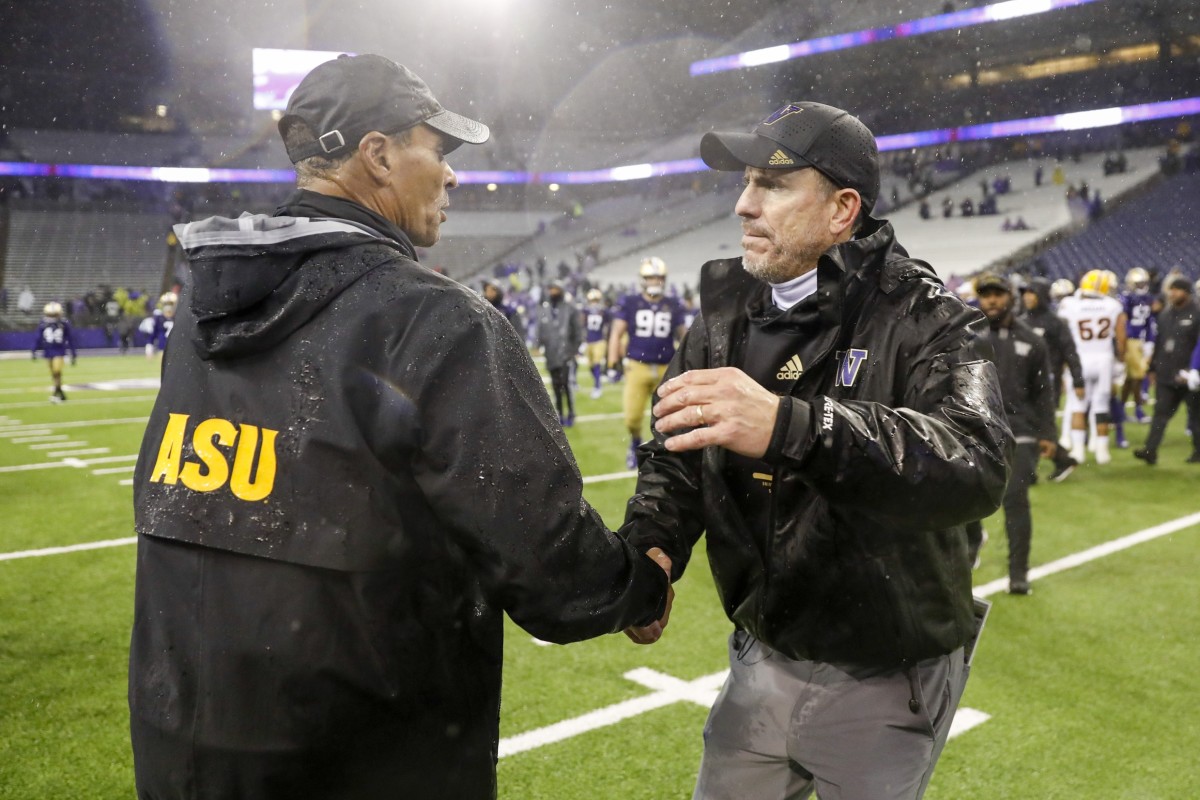 Herm Edwards and Bob Gregory meet after the 2021 game in Seattle. Neither coach remains with either school, ASU or the UW.
