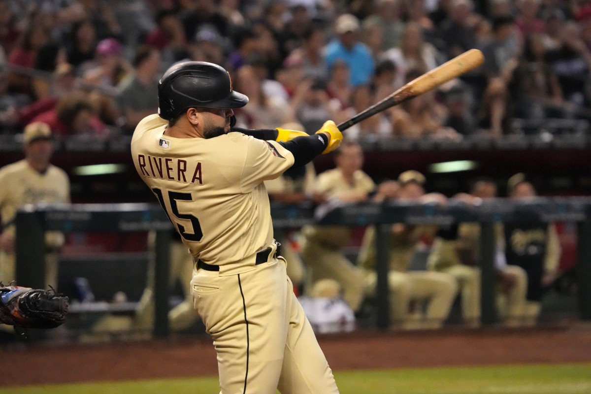 Sep 23, 2022; Phoenix, Arizona, USA; Arizona Diamondbacks designated hitter Emmanuel Rivera (15) hits a two RBI double against the San Francisco Giants during the fifth inning at Chase Field. Mandatory Credit: Joe Camporeale-USA TODAY Sports