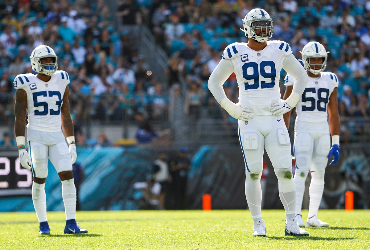 Indianapolis Colts outside linebacker Darius Leonard (53), defensive tackle DeForest Buckner (99) and middle linebacker Bobby Okereke (58) stand in between plays during the second quarter of the game on Sunday, Jan. 9, 2022, at TIAA Bank Field in Jacksonville, Fla. The Indianapolis Colts Versus Jacksonville Jaguars On Sunday Jan 9 2022 Tiaa Bank Field In Jacksonville Fla