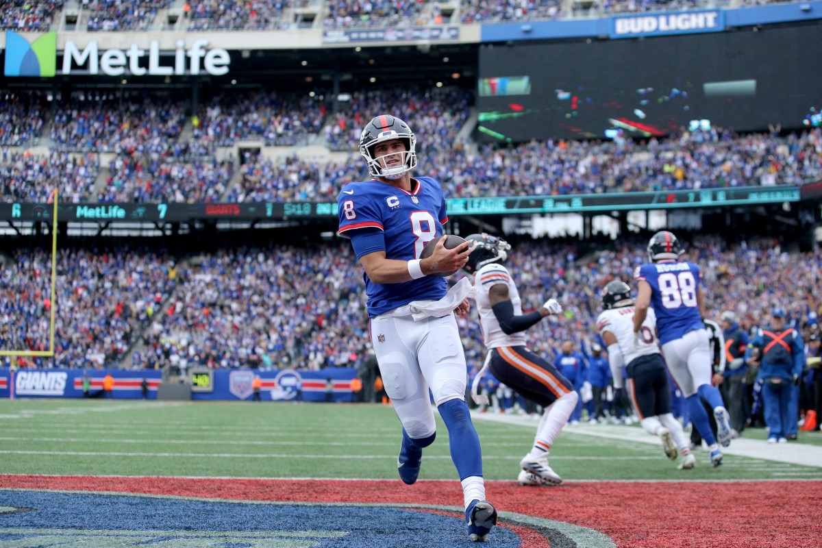 Oct 2, 2022; East Rutherford, New Jersey, USA; New York Giants quarterback Daniel Jones (8) runs for a touchdown against the Chicago Bears during the second quarter at MetLife Stadium.