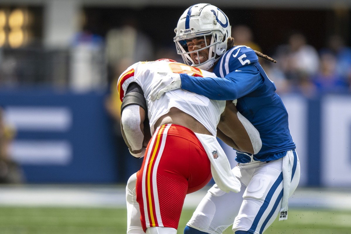 Sep 25, 2022; Indianapolis, Indiana, USA; Indianapolis Colts cornerback Stephon Gilmore (5) tackles Kansas City Chiefs wide receiver JuJu Smith-Schuster (9) during the second quarter at Lucas Oil Stadium. Mandatory Credit: Marc Lebryk-USA TODAY Sports