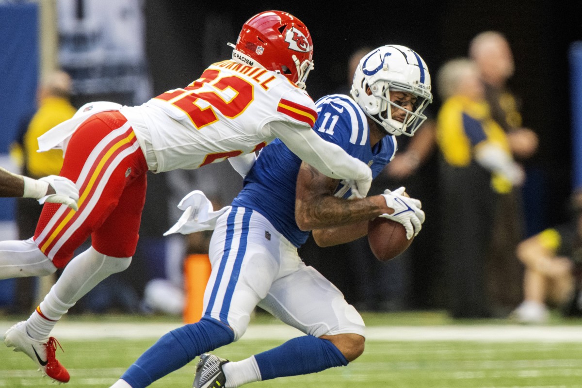 Sep 25, 2022; Indianapolis, Indiana, USA; Indianapolis Colts wide receiver Michael Pittman Jr. (11) catches a pass under coverage from Kansas City Chiefs safety Juan Thornhill (22) during the second half at Lucas Oil Stadium. Mandatory Credit: Marc Lebryk-USA TODAY Sports