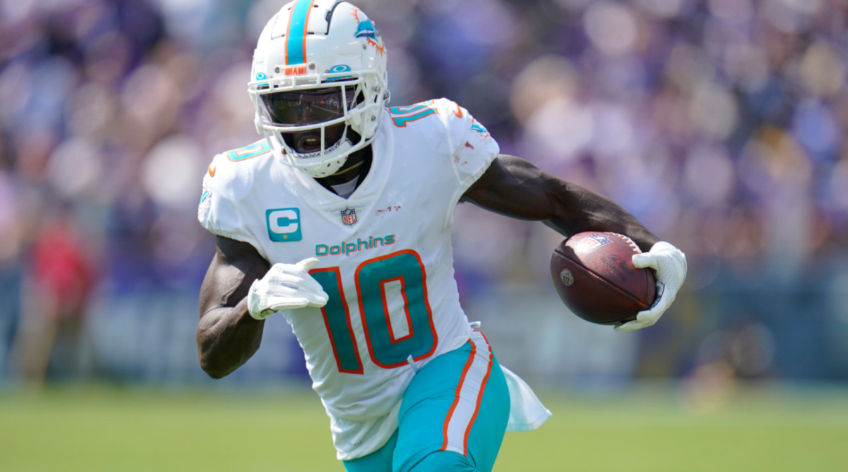Miami Dolphins wide receiver Tyreek Hill (10) runs a play during the first half of an NFL football game against the Baltimore Ravens, Sunday, Sept. 18, 2022, in Baltimore. (AP Photo/Julio Cortez)