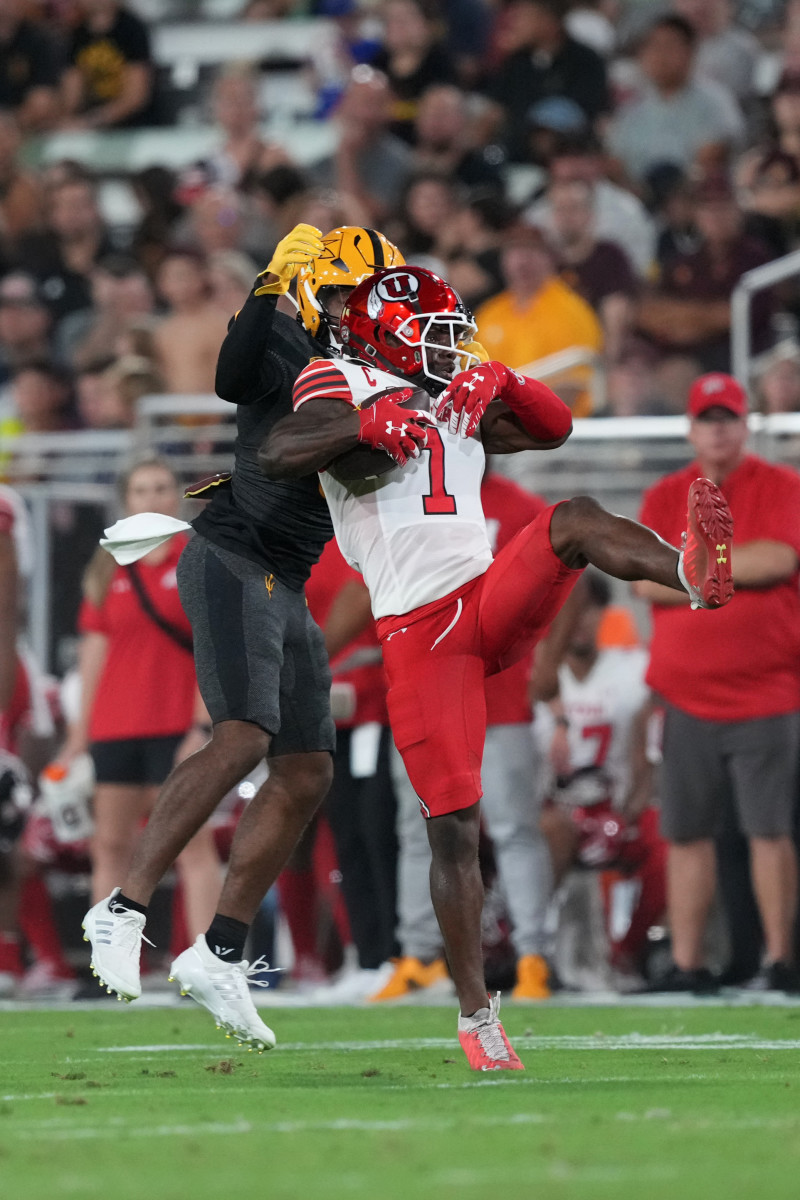 Utah Utes cornerback Clark Phillips III (1) intercepts a pass intended for Arizona State Sun Devils wide receiver Charles Hall IV (0) during the first half at Sun Devil Stadium.
