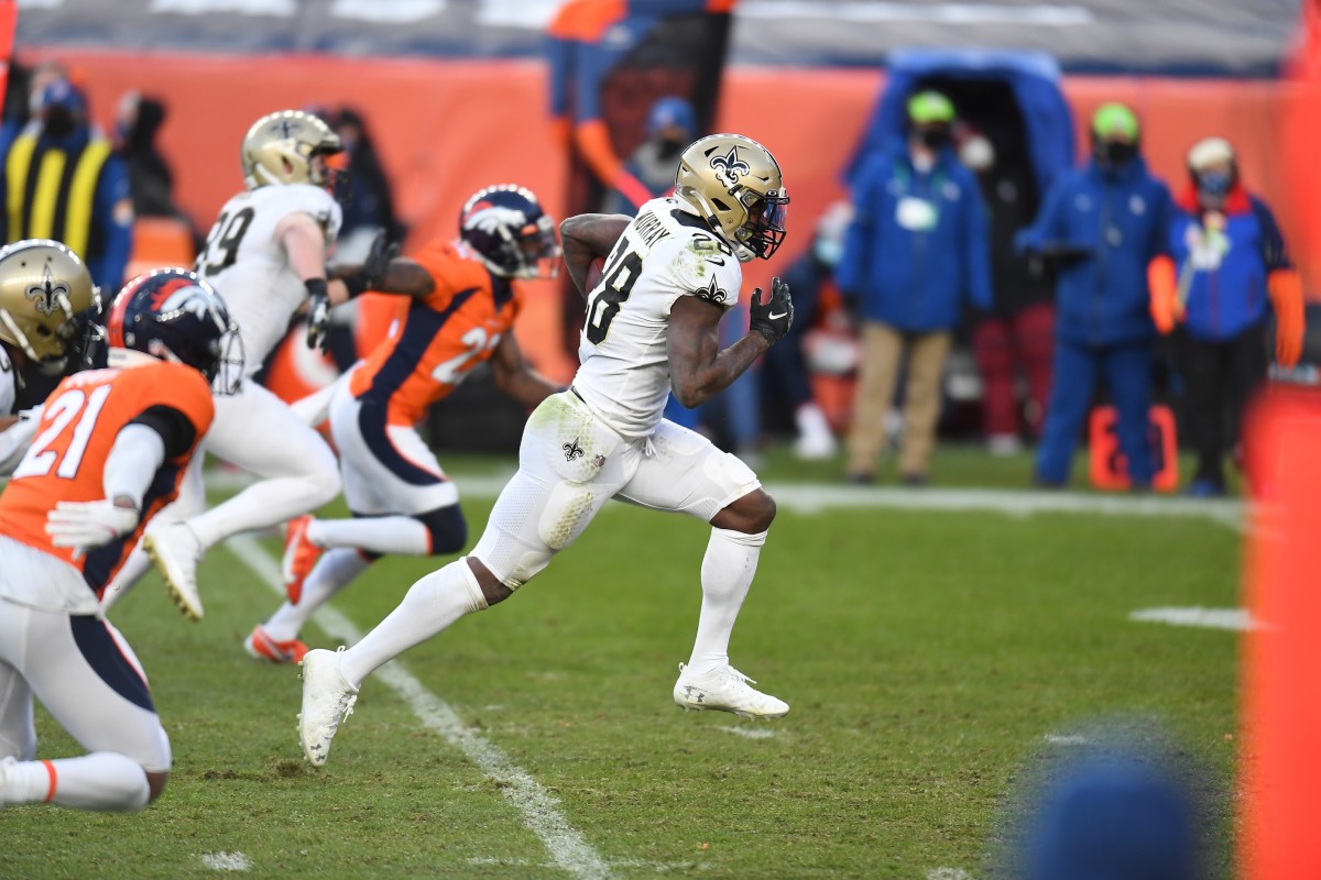 Nov 29, 2020; New Orleans Saints running back Latavius Murray (28) runs for a touchdown against the Denver Broncos. Mandatory Credit: Ron Chenoy-USA TODAY