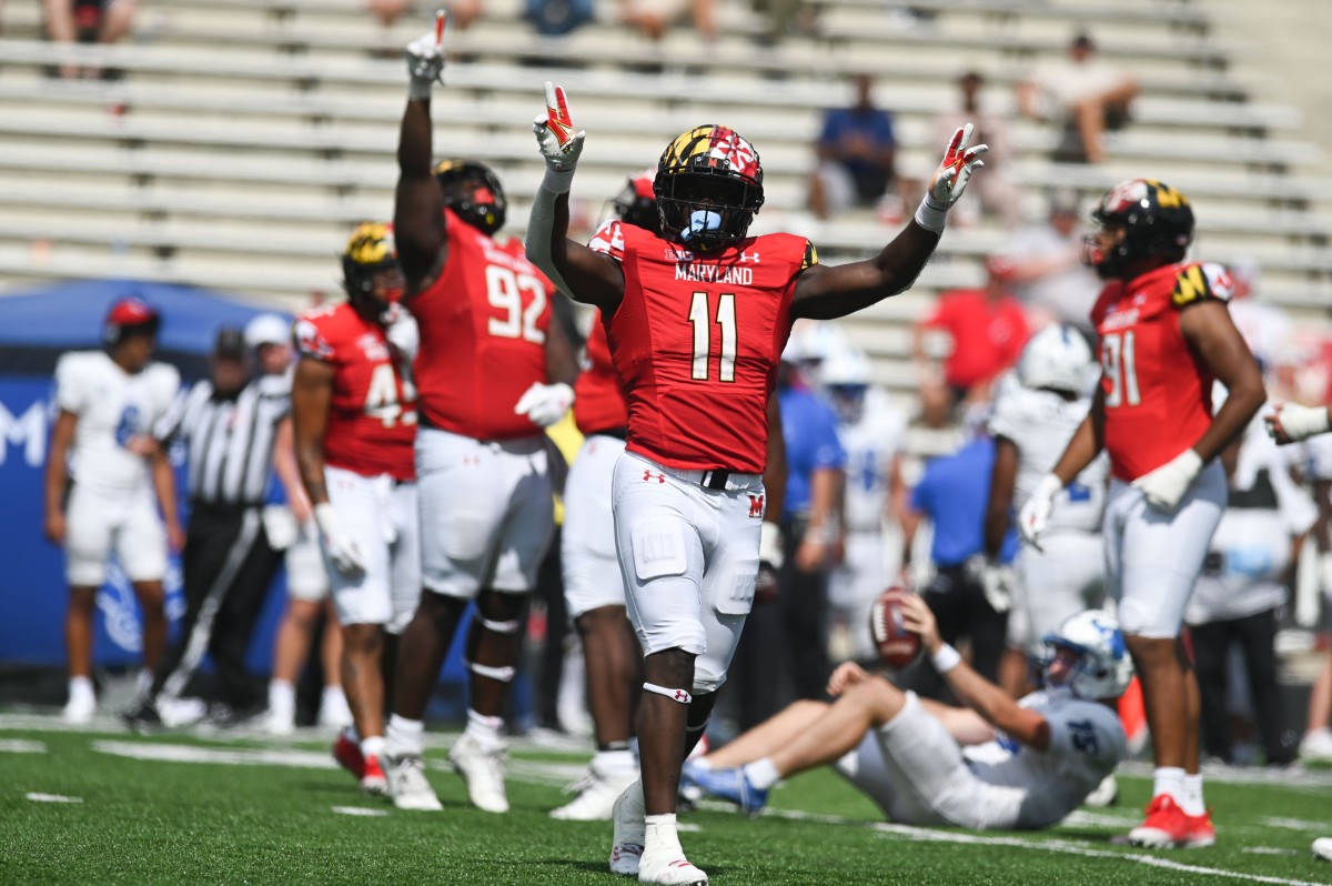Sep 3, 2022; College Park, Maryland, USA; Maryland Terrapins linebacker Ruben Hyppolite II (11) reacts after defensive lineman Henry Chibueze (92) sacked Buffalo Bulls quarterback Cole Snyder (15) during the second half at Capital One Field at Maryland Stadium.