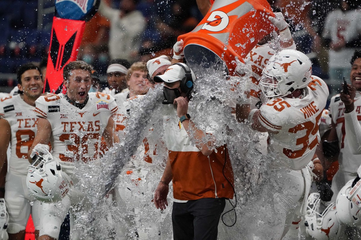 San Antonio, TX, USA; Texas Longhorns coach Tom Herman is doused with Gatorade at the end of the game against the Colorado Buffaloes during the Alamo Bowl at the Alamodome. Texas defeated Colorado 55-23