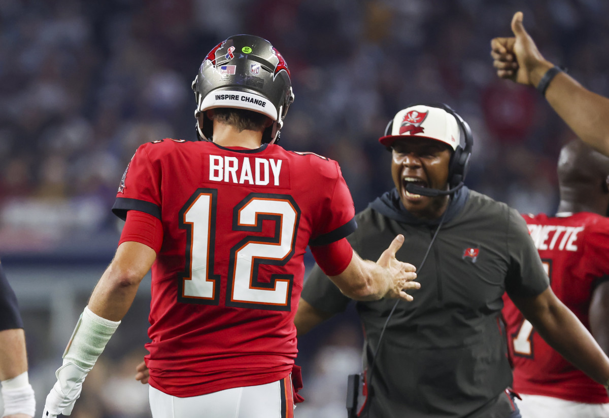 Arlington, Texas, USA; Tampa Bay Buccaneers quarterback Tom Brady (12) celebrates with offensive coordinator Byron Leftwich after throwing a touchdown pass during the second half at AT&T Stadium.