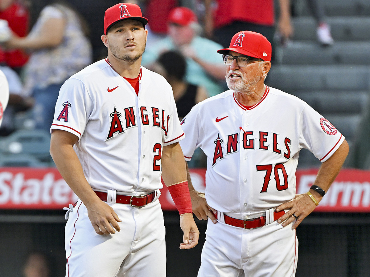 ANAHEIM, CA - APRIL 07: Los Angeles Angels centerfielder Mike Trout (27) with manager Joe Maddon (70) at home plate during opening day player introductions before an MLB baseball game against the Houston Astros played on April 7, 2022 at Angel Stadium in Anaheim, CA.