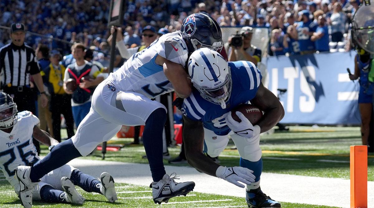 Tennessee Titans linebacker Dylan Cole (53) chases after Indianapolis Colts tight end Mo Alie-Cox (81) as he makes his way into the end zone for a touchdown Sunday, Oct. 2, 2022, during a game against the Tennessee Titans at Lucas Oil Stadium in Indianapolis.