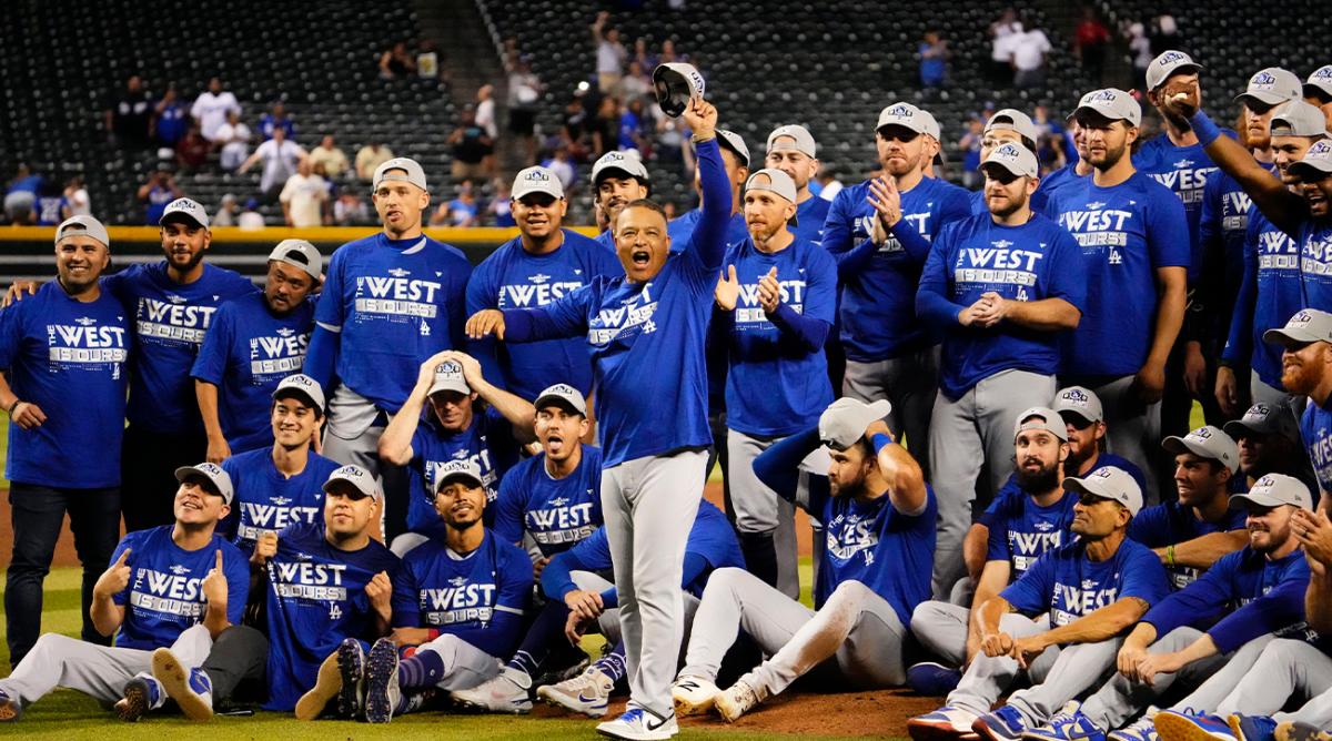Sep 13, 2022; Phoenix, Arizona, USA; Los Angeles Dodgers manager Dave Roberts (30) salutes fans after clinching the National League West Division after defeating the Arizona Diamondbacks 4-0 at Chase Field.